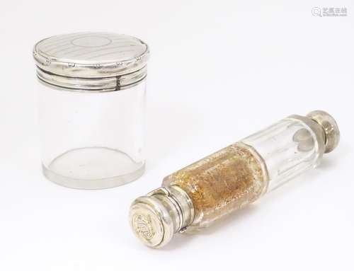 A double ended glass scent bottle with white metal…