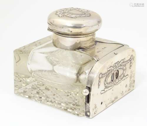 A glass inkwell having unusual silver date panel m…