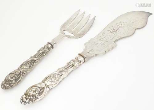 A cased pair of silver plate fish servers with Art…