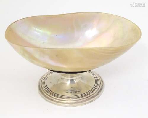 A bonbon / sweetmeat dish, the mother of pearl bow…