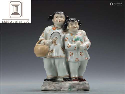 A Chinese Famille Rose Porcelain Boy Statue