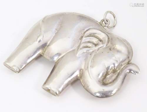 A white metal pendant formed as an elephant with s…