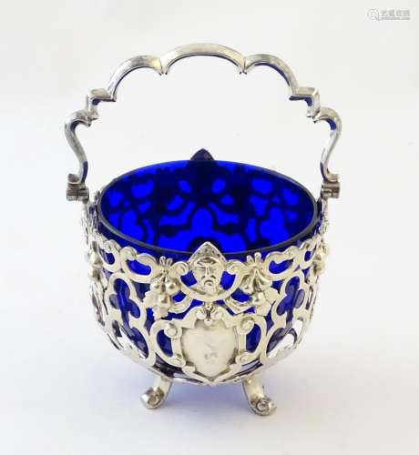 A Victorian silver sugar basket with pierced decor…