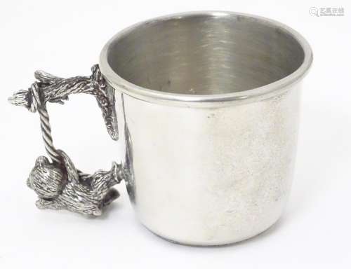 A silver plate Christening mug with bear decorati…