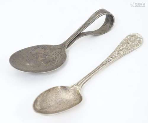 A silver teaspoon with stylised cherub detail to h…