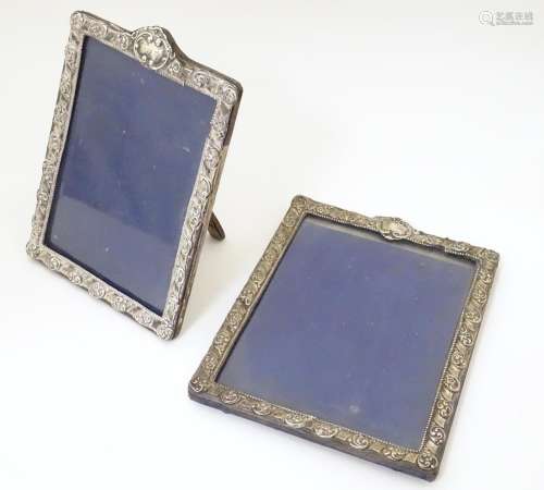 Two photograph frames with silver surrounds havin…