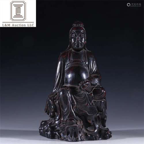 A Chinese Carved Zitan Wood Buddha Statue