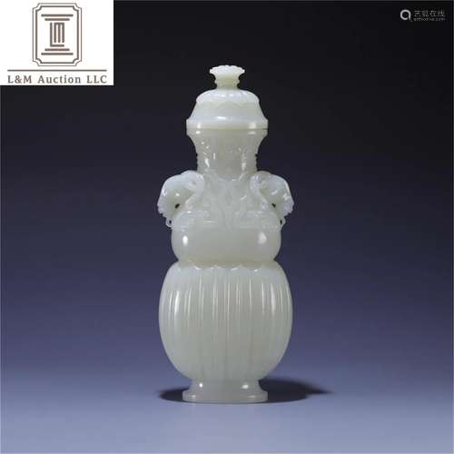 A Chinese Carved Jade Lidded Vase with Goat Ear