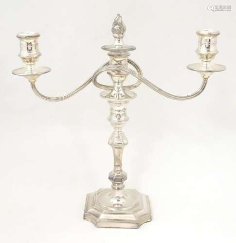 A silver plate table candelabra with two scrolling…