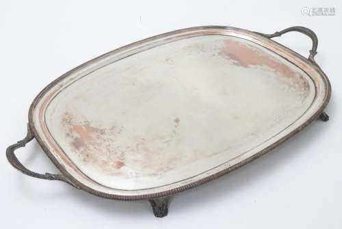 A silver plate tray with twin handles and four fee…