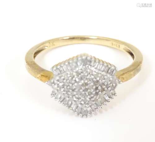 A 19ct gold ring set with diamond cluster. Ring si…