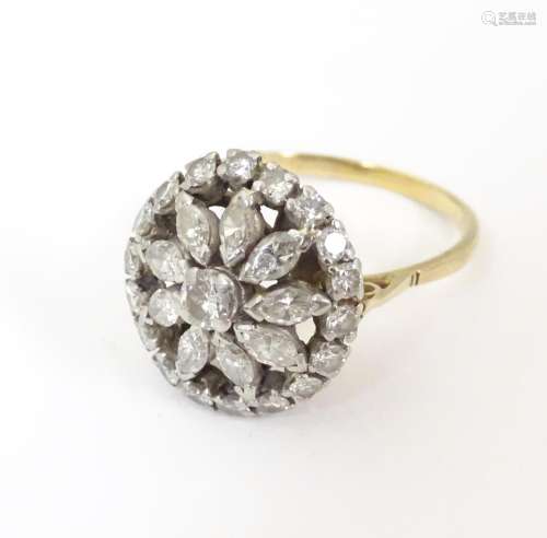 An 18ct gold ring with central floral set diamonds…