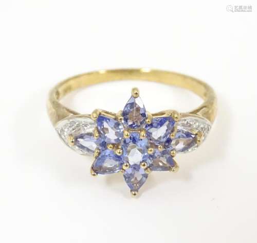 A 9ct gold ring set with tanzanite coloured stone …