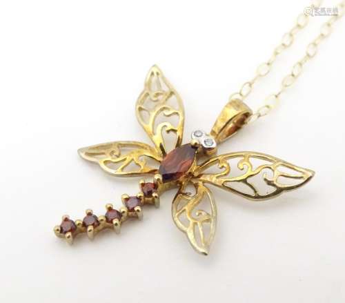 A 9ct gold necklace the pendant formed as a dragon…