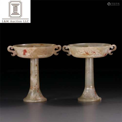 A Pair of Carved Jade Candlesticks