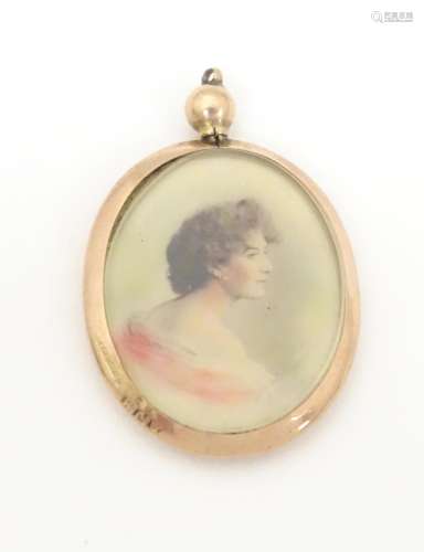 A pendant of oval form with photographic portrait …