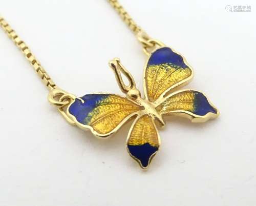 A necklace with butterfly pendant with enamel deco…