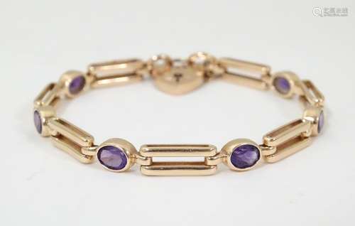 A 9ct gold bracelet of link form set with oval ame…