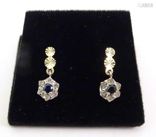 A pair of 9ct gold sapphire and diamond floral clu…