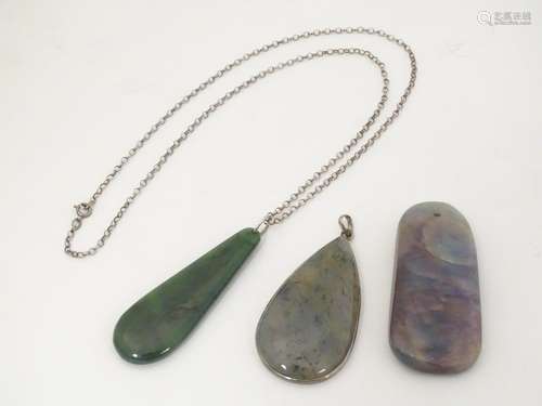 Three various hardstone pendants The largest 2 1/4…