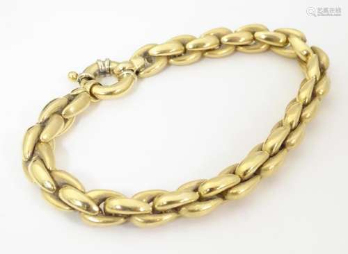 An 18ct gold bracelet. Approx. 7 1/2" long …