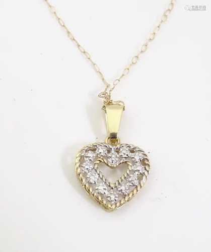 An American 10k gold necklace with heart formed p…