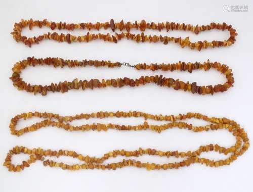 Three various vintage necklaces of amber coloured …