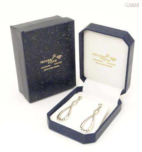 A pair of .925 silver drop earrings, in a box mar…