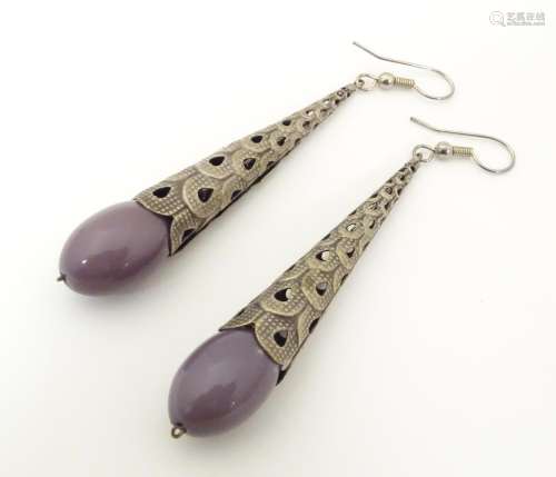 A pair of drop earrings, the mauve beads mounted i…