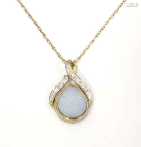 A 9ct gold necklace the pendant set with opal and …