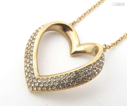 Swarovski : A gilt metal necklace with heart shape…