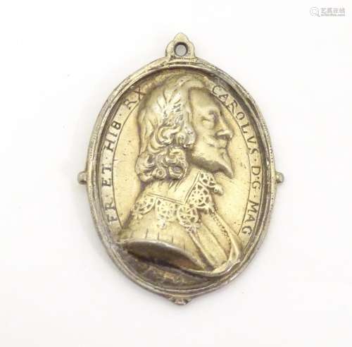 An oval silver gilt Royalist medal of Charles I an…