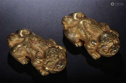 A Pair of Gilt Silver Lion Ornaments