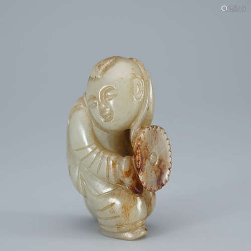 A Carved Russet Jade Figure of Boy