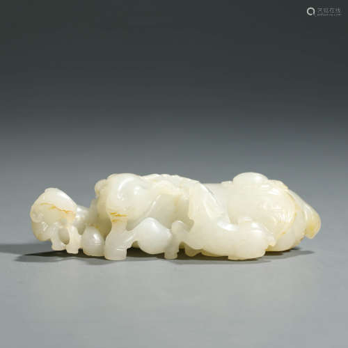 A Carved White Jade Three Rams Ornament