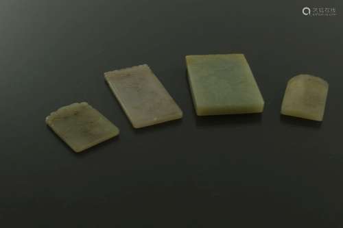 Four Chinese carved jade pendant plaques