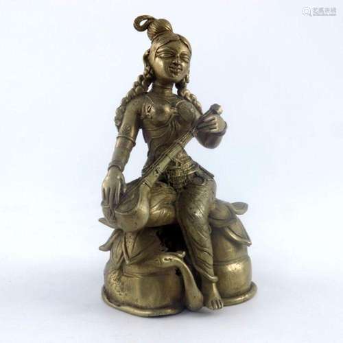 An Indian cast brass figure of a female