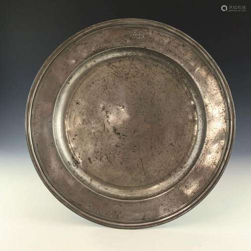 A 17th century pewter charger, marked WP