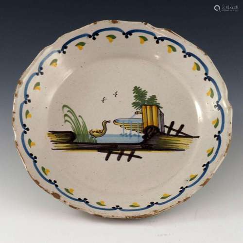 A French faience plate, circa 1800, pain