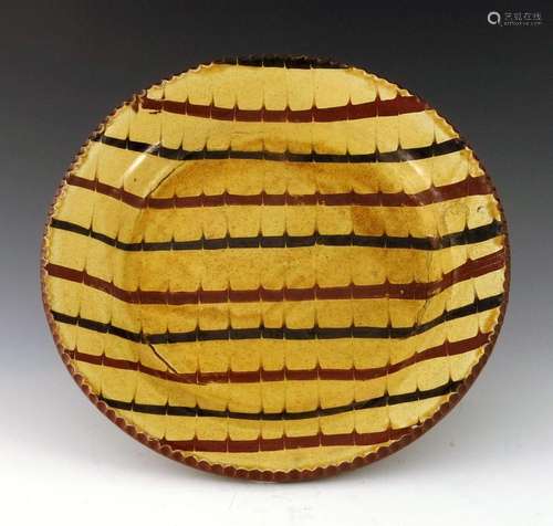 A 19th century Staffordshire slipware di