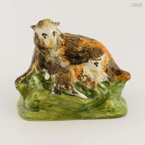 A pearlware figure of lambs and ewe, cir