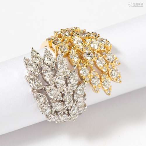 AN 18 CARAT WHITE AND YELLOW GOLD DIAMOND CROSSOVER RING