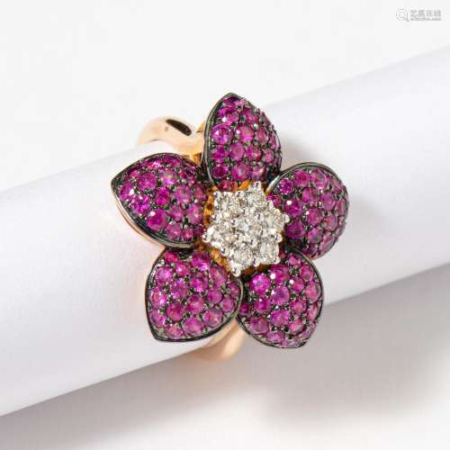 AN 18 CARAT ROSE GOLD DIAMOND AND RUBY FLOWER COCKTAIL RING