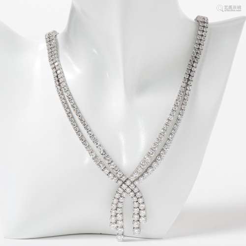 AN EXCEPTIONAL 18 CARAT WHITE GOLD AND DIAMOND RIVIÈRE NECKL...