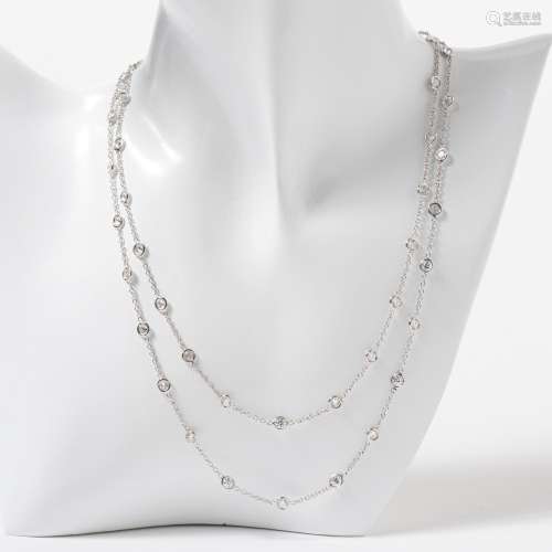 AN 18 CARAT WHITE GOLD AND DIAMOND RIVIÈRE STATION NECKLACE