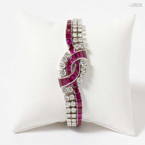 AN 18 CARAT WHITE GOLD RUBY AND DIAMOND LINE BRACELET