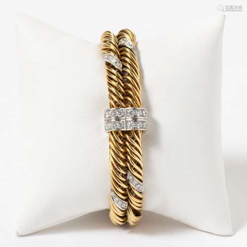 AN 18 CARAT YELLOW GOLD AND DIAMOND FANCY LINK BRACELET BY P...