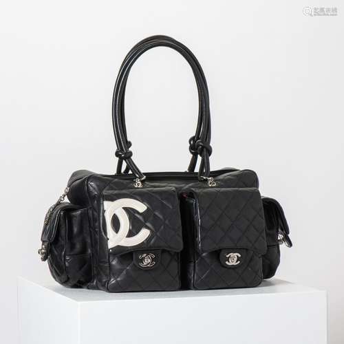 A CHANEL BLACK AND WHITE LAMBSKIN LEATHER CAMBON REPORTER BA...