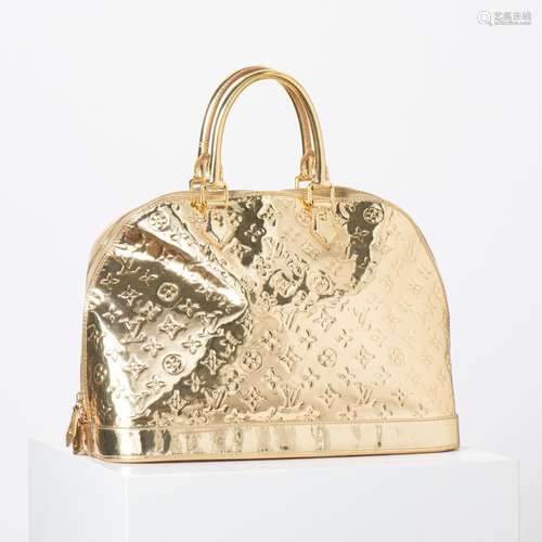 A LOUIS VUITTON LIMITED EDITION GOLD MONOGRAM MIROIR ALMA GM...