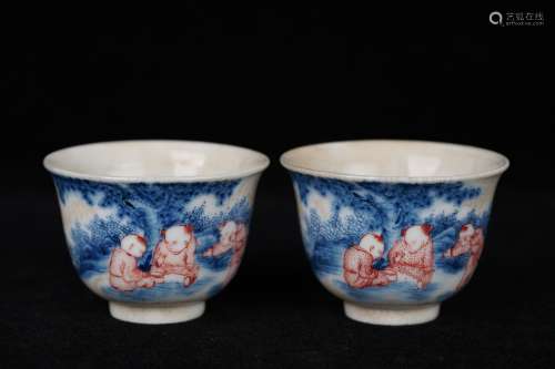 A Pair Of Red In Blue And Wite Porcelain Cups